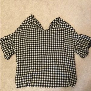 Black and white checked top.